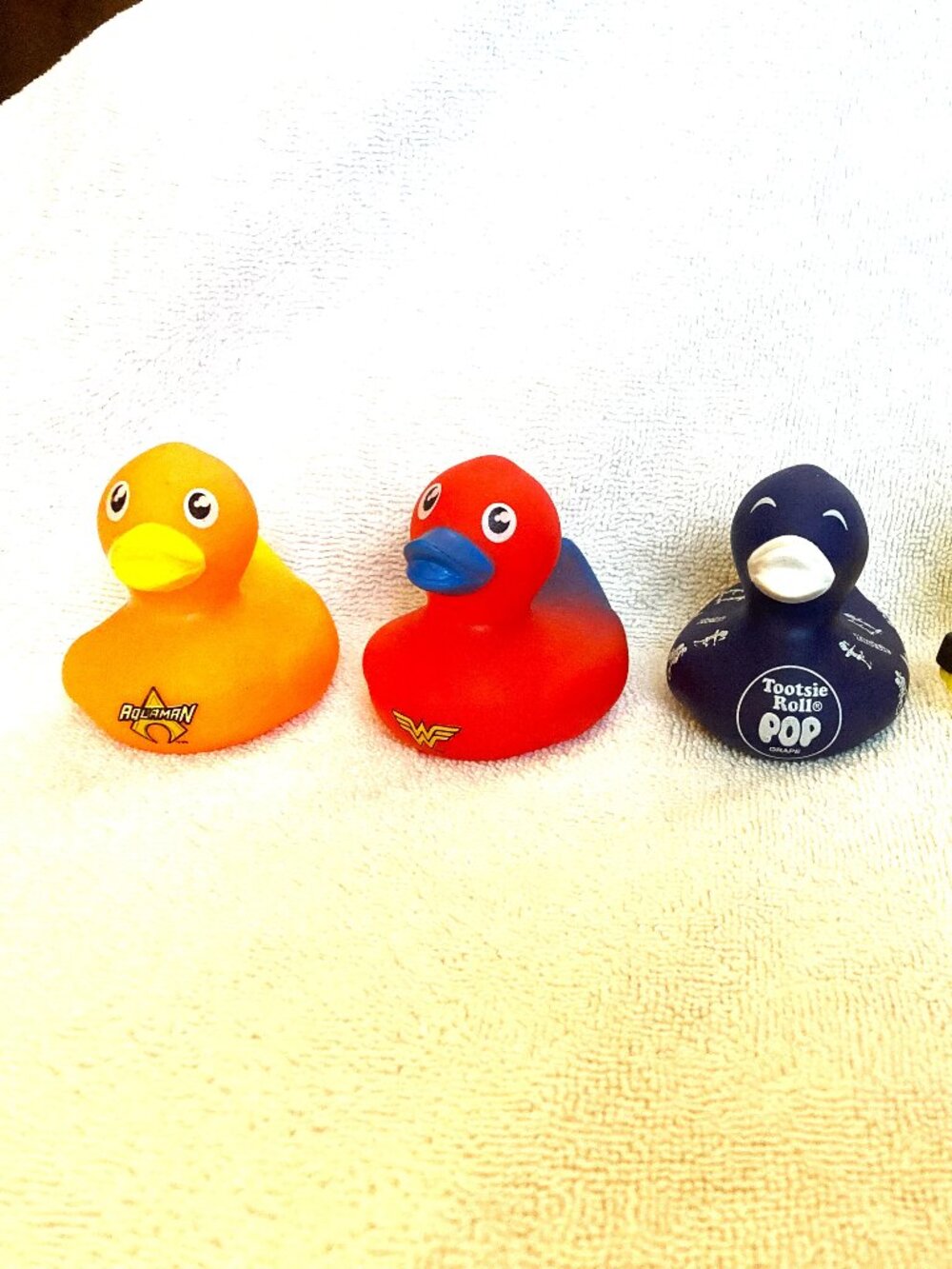 5 Unique Plastic Ducks, Aqua man, Wonder woman, Tootsie Roll, Valentine